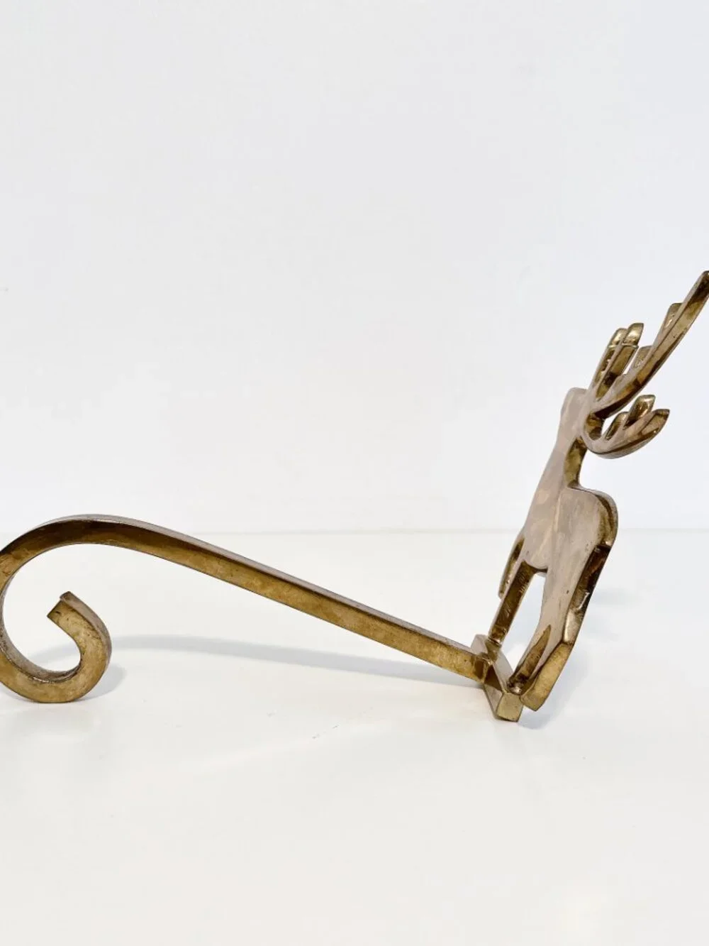 SET OF FOUR BRASS REINDEER MANTEL STOCKING HANGERS